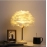 Ceramic feather table lamp, female bedroom table lamp, bedside lamp, light luxury, high-end home decoration, romantic and warm gift